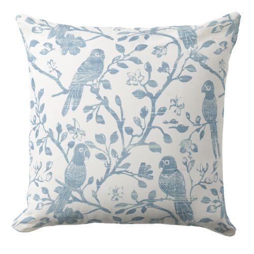 A coastal bird decorative throw pillow in a hand block style print in light blue ink on a white