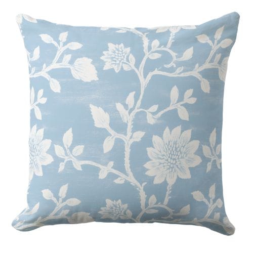 A dark blue throw pillow in a coastal style.