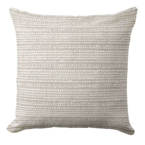 A coastal throw pillow featuring a modern striped pattern in a muted blue and white.
