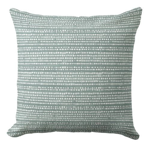 A coastal throw pillow featuring a modern striped pattern in a muted blue and white.