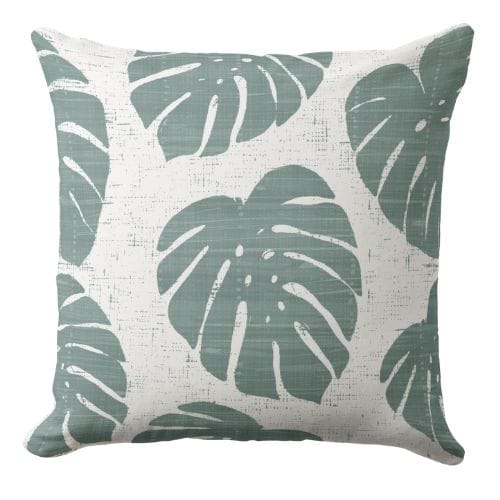 a decorative blue throw pillow featuring a Hamptons style ornate pattern in indigo blue and white.
