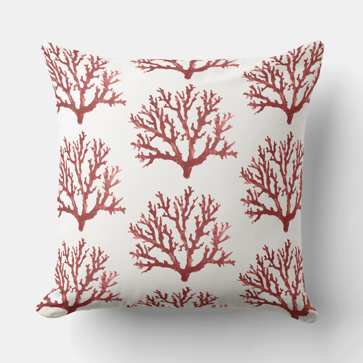 a decorative blue throw pillow featuring a Hamptons style ornate pattern in indigo blue and white.