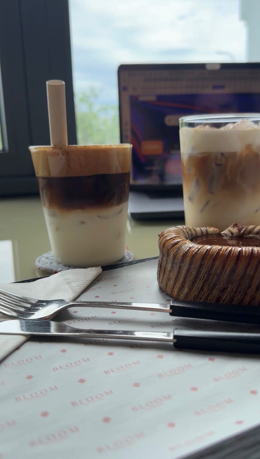 Coffee, pastries, and a laptop during a work session