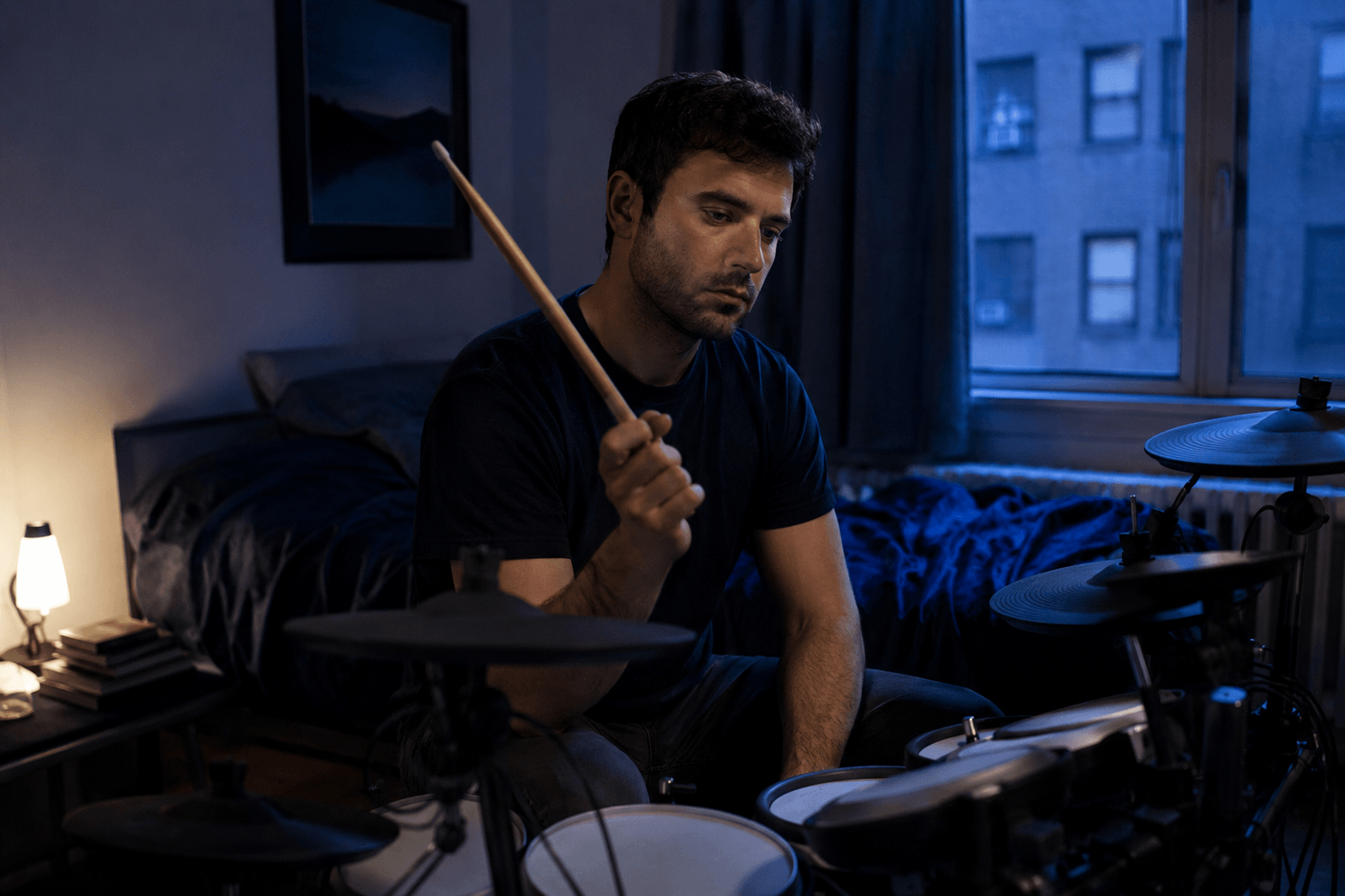 Drummer looking frustrated near a quiet drum kit in a small apartment