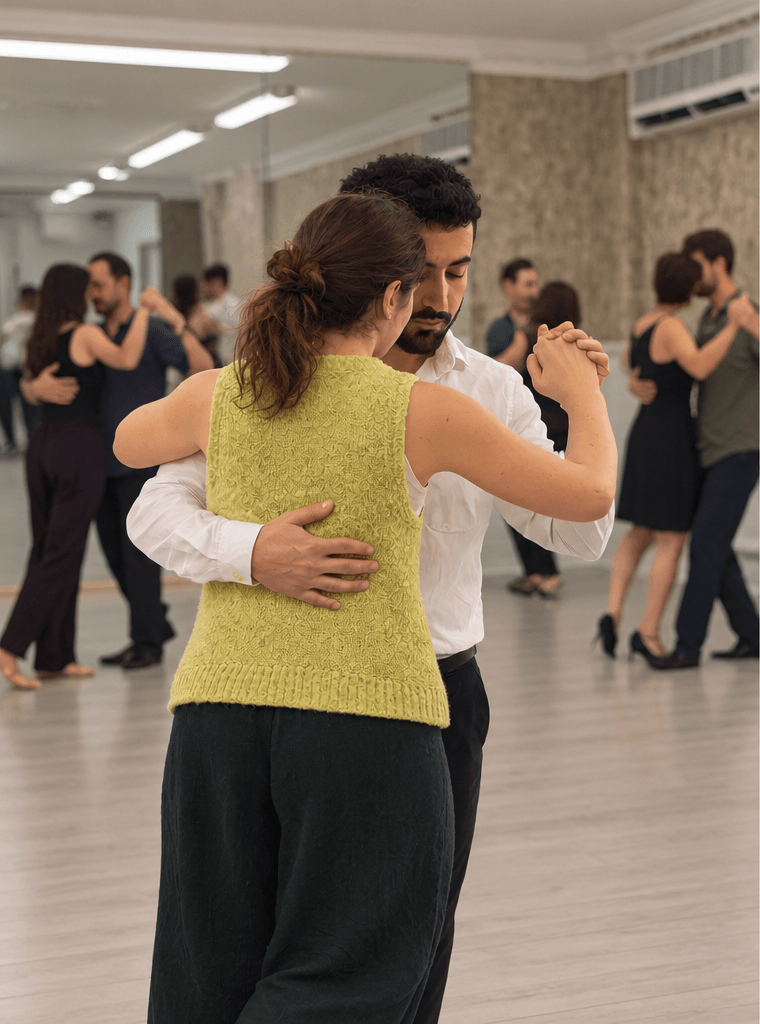 Two dancers in a tango embrace during a class at Silvia Tango Hub