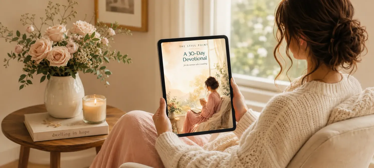 A woman reading The Still Point devotional in a quiet moment