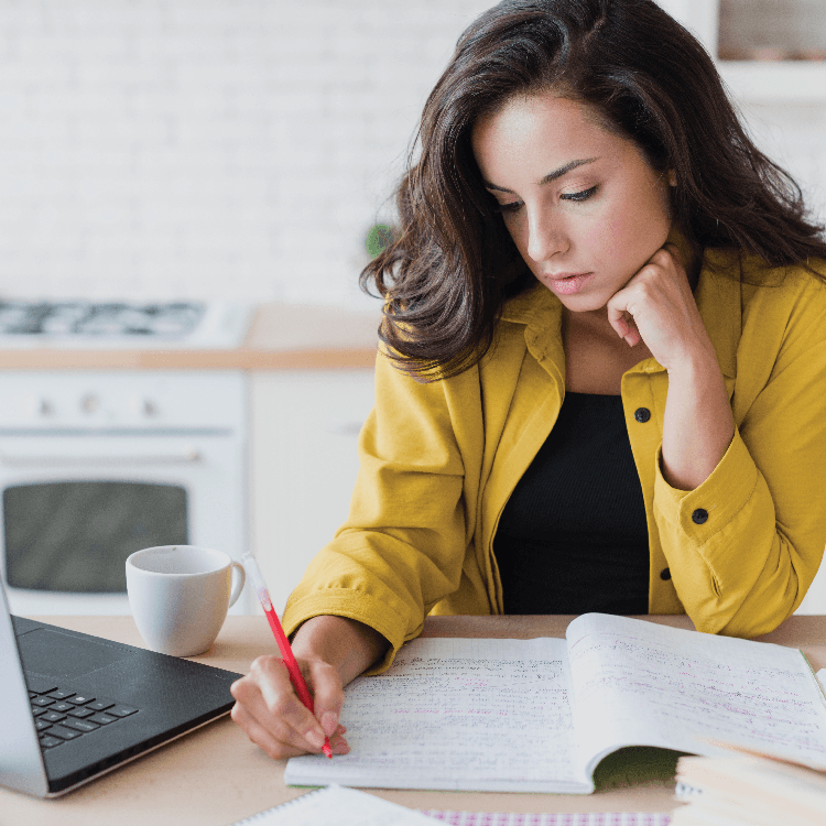 Female entrepreneur reviewing her conversion funnel and email marketing  strategy at home — representing coaches and consultants losing revenue  between touchpoints.