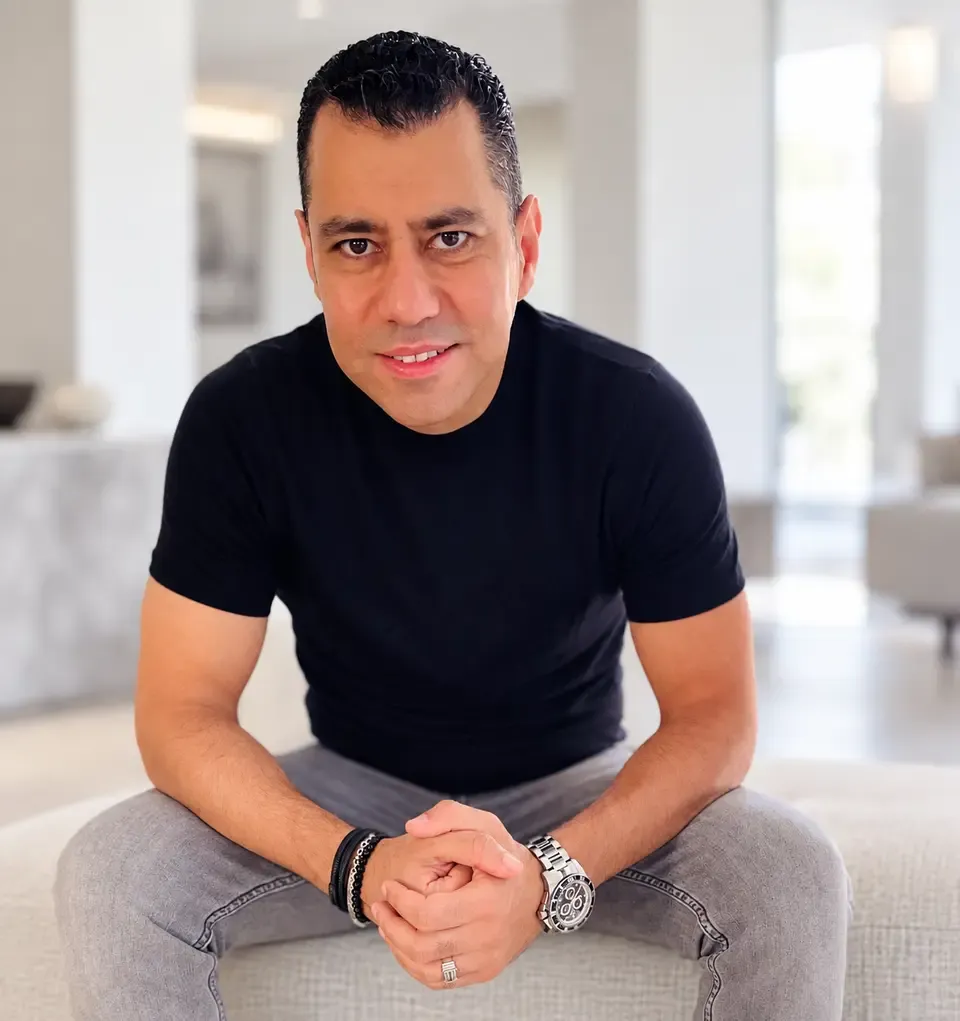 Ahmad Haikal seated in a relaxed portrait