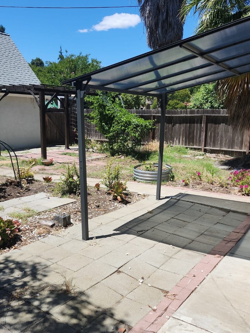 After yard cleanup showing cleaner yard area