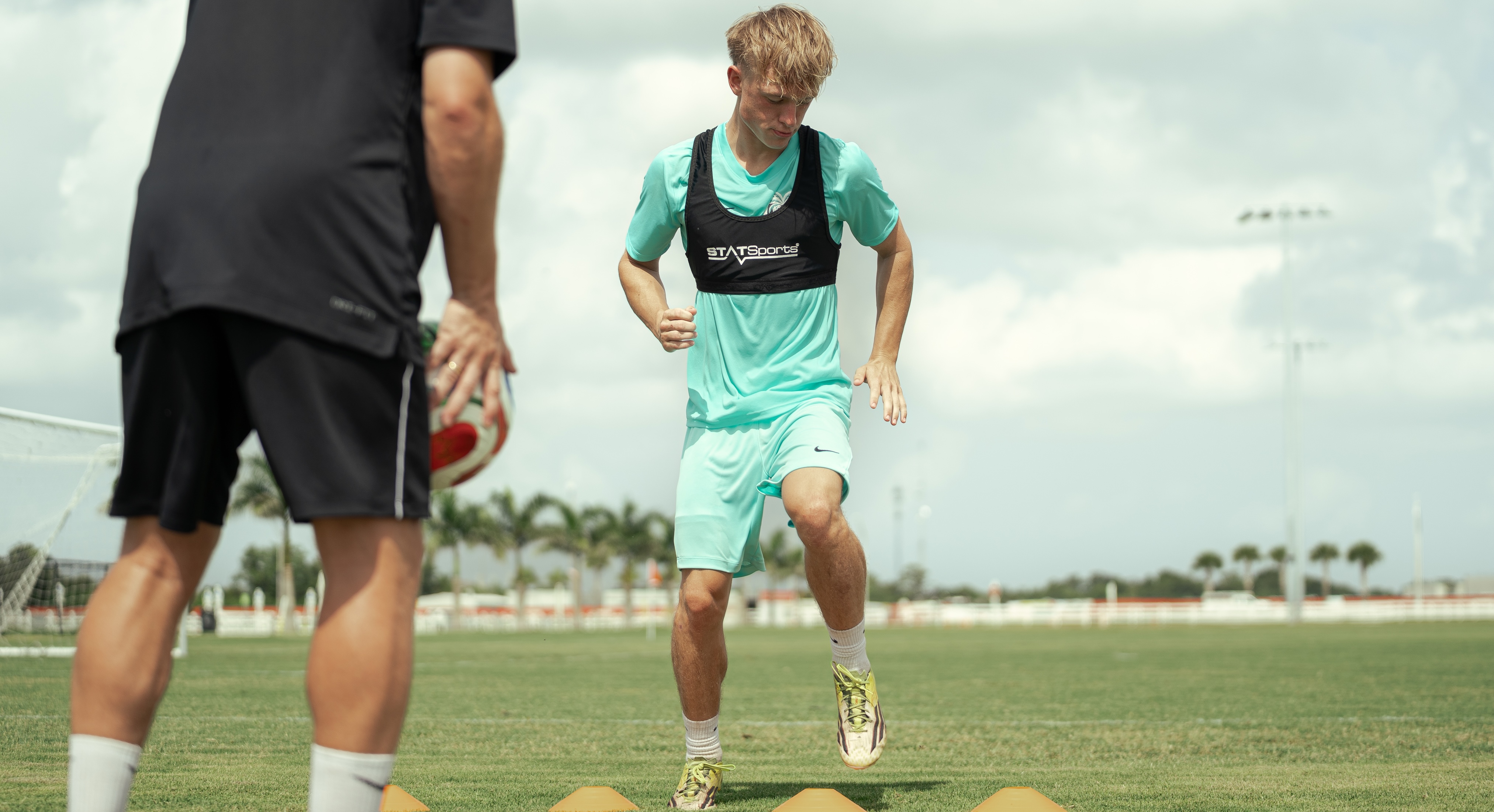 Young player dribbling the ball during training with Federico