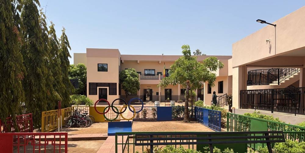 school courtyard trees benches classroom buildings