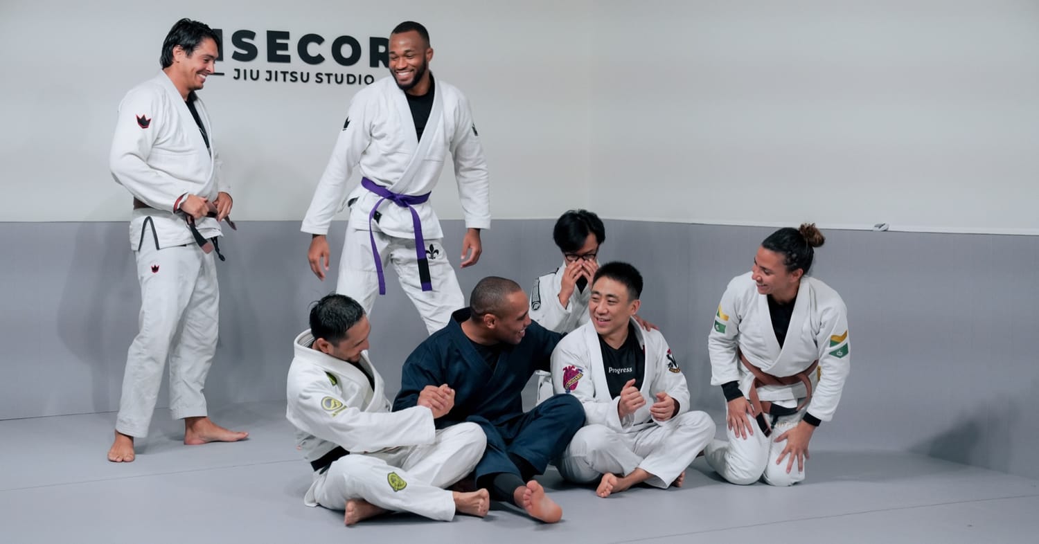 Grapplers laughing together on the mat