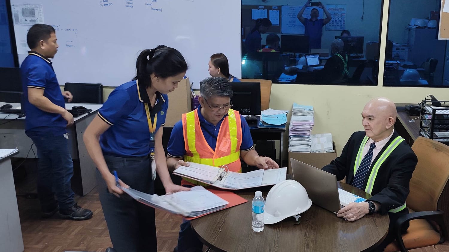 ISOGAP lead auditor and team reviewing internal control system audit records