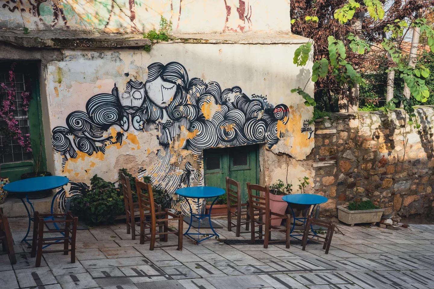Outdoor café tables in a neighbourhood street in Athens