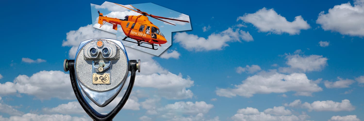 Heli über dem Meer mit dem Spruch: Worauf man seinen Fokus richtet, das wird wahr.