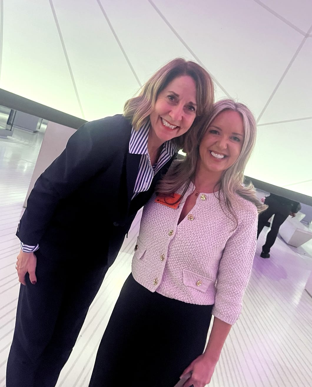 Lucy Gilmour standing with Liz Kendall at the AI Adoption Summit