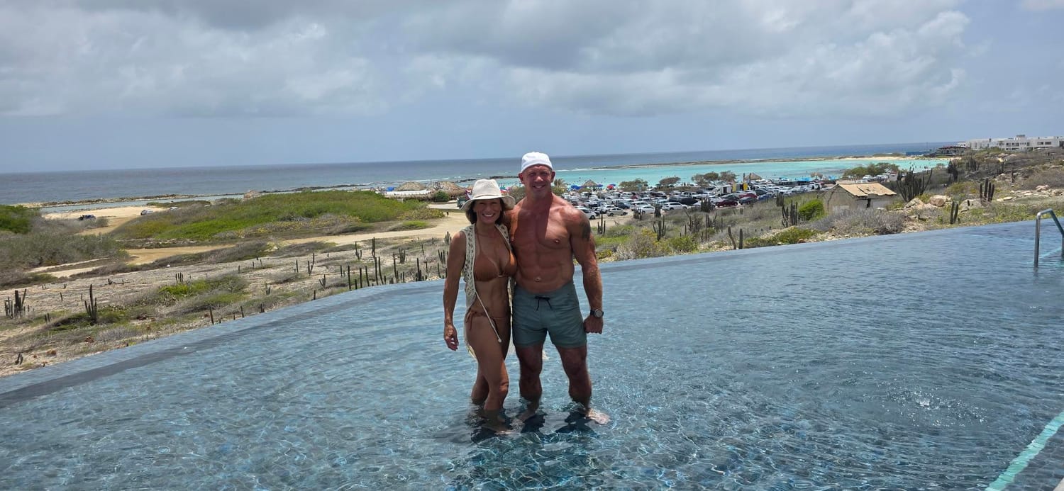 Josh and Sandy in an infinity pool in Aruba