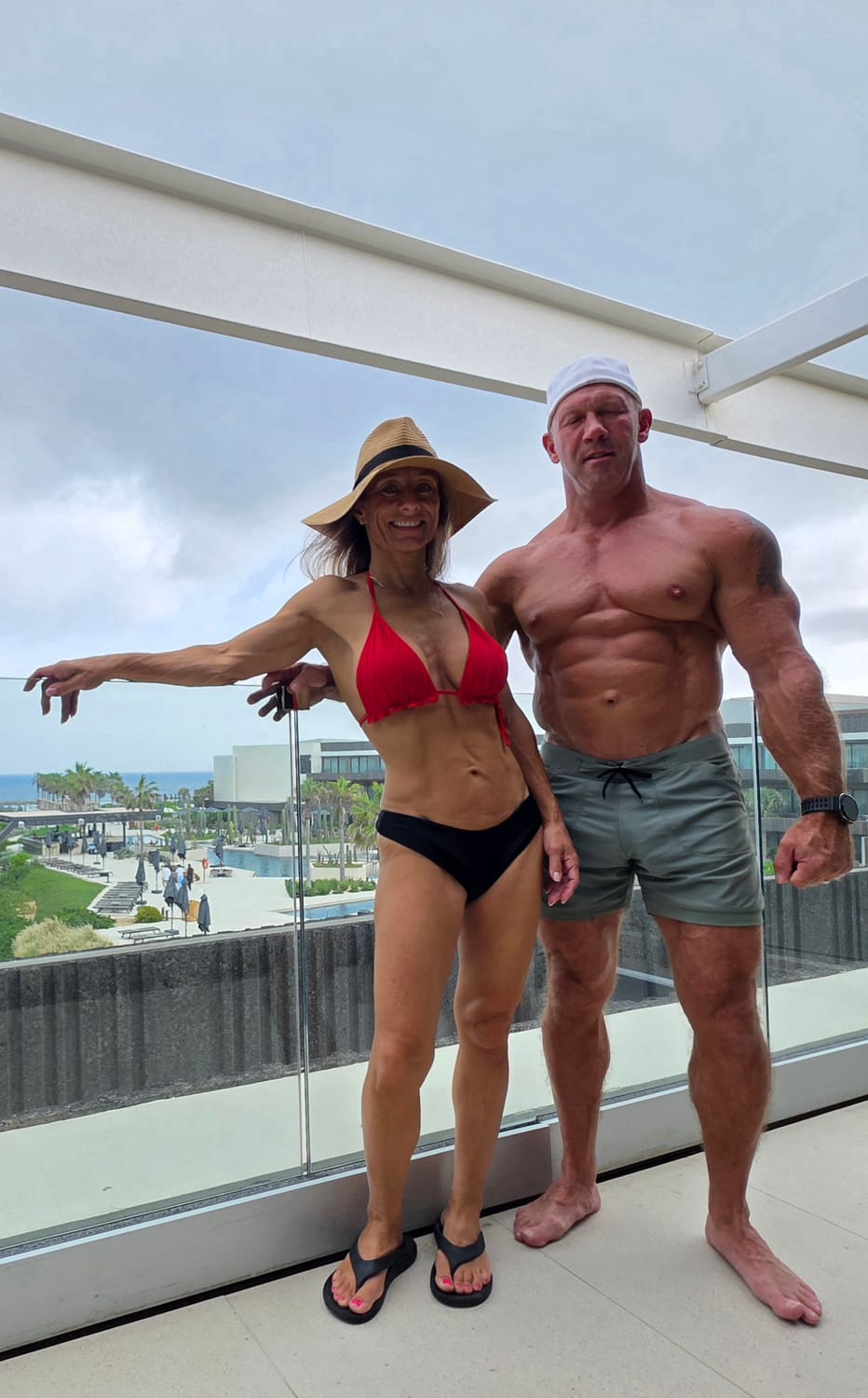 Josh and Sandy on a balcony overlooking the resort