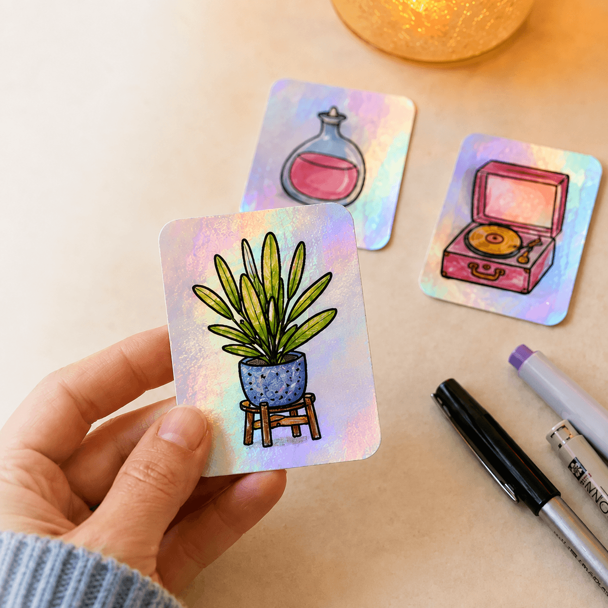 Hand holding a holographic plant drawing