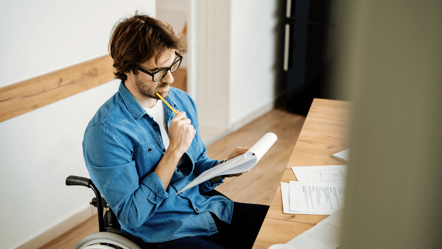 man looking at clipboard