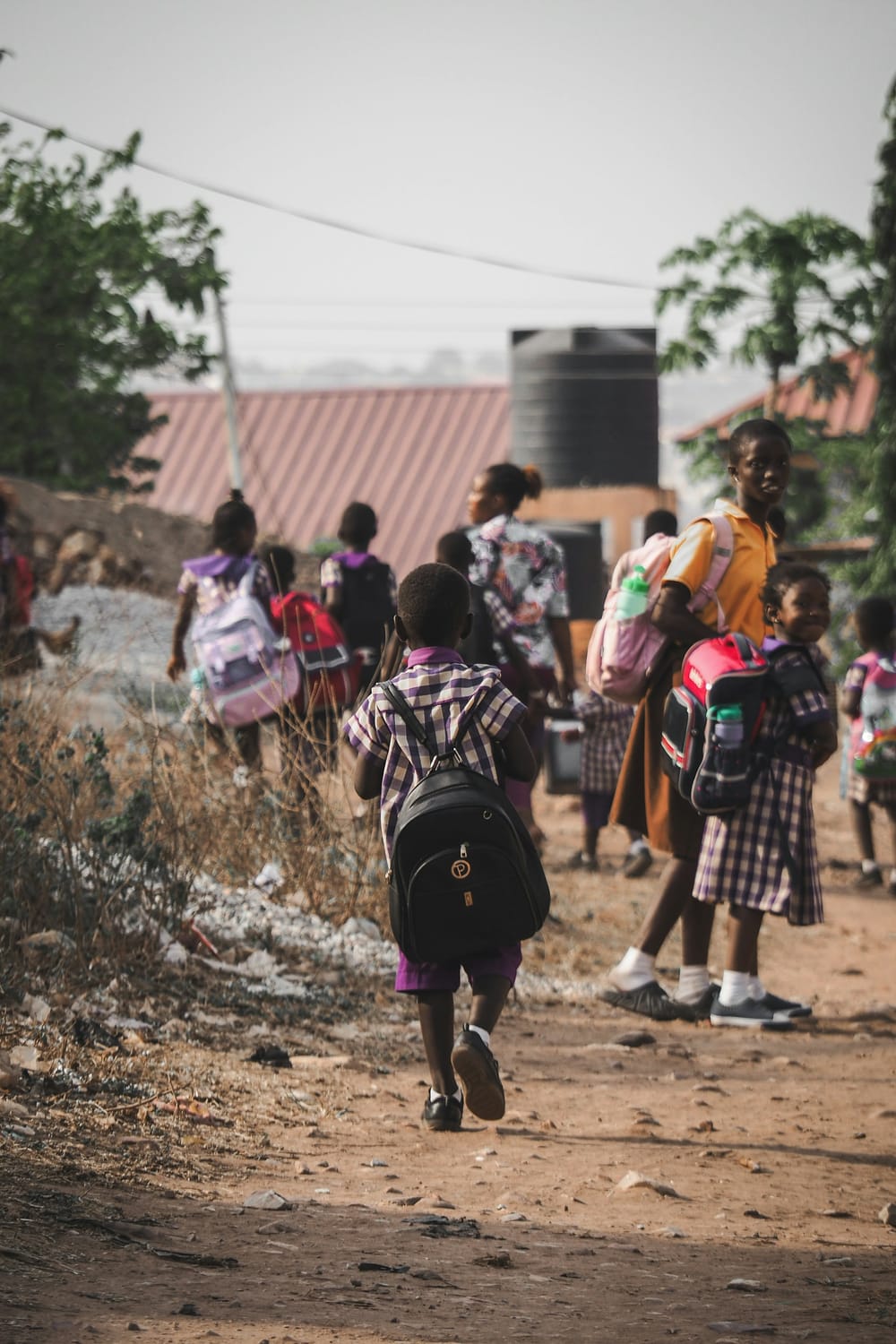 African Children walking home. Photo by David Geneugelijk"https://unsplash.com/photos/children-walk-home-after-school-ycaYQ9qn2pE?utm_source=unsplash"