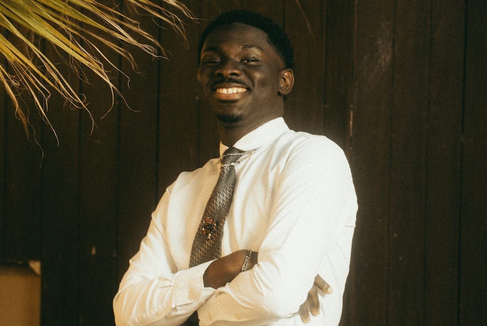Smiling African Businessman Photo by unsplash.com/@chriscreation