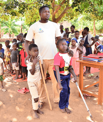 Ben Mukasa with the Davion Cares children
