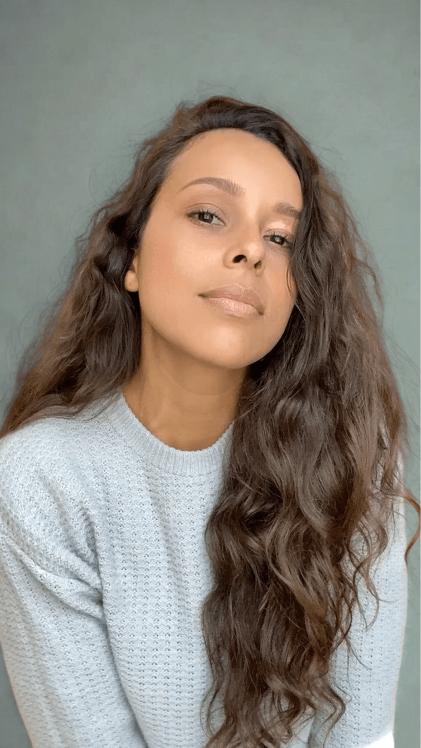 Founder of Being Her Now with long, healthy-looking hair