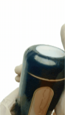 A finger covering and releasing the airflow hole to change the suction