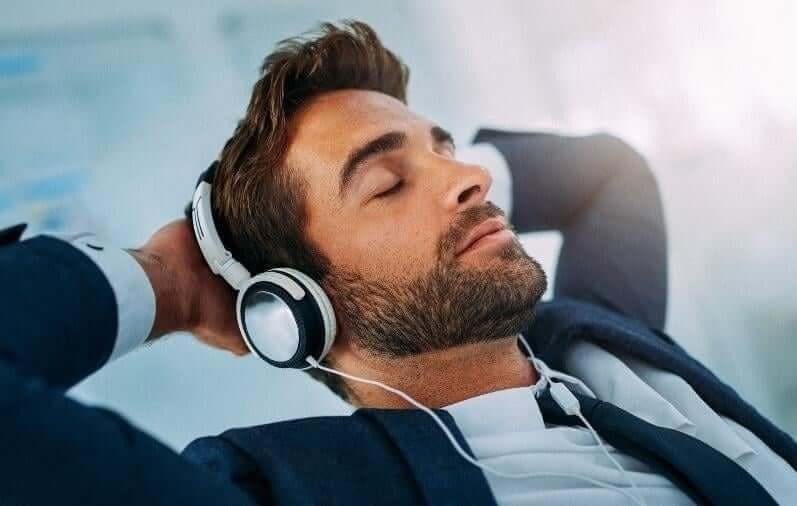 man, headphones, eyes closed, relaxed