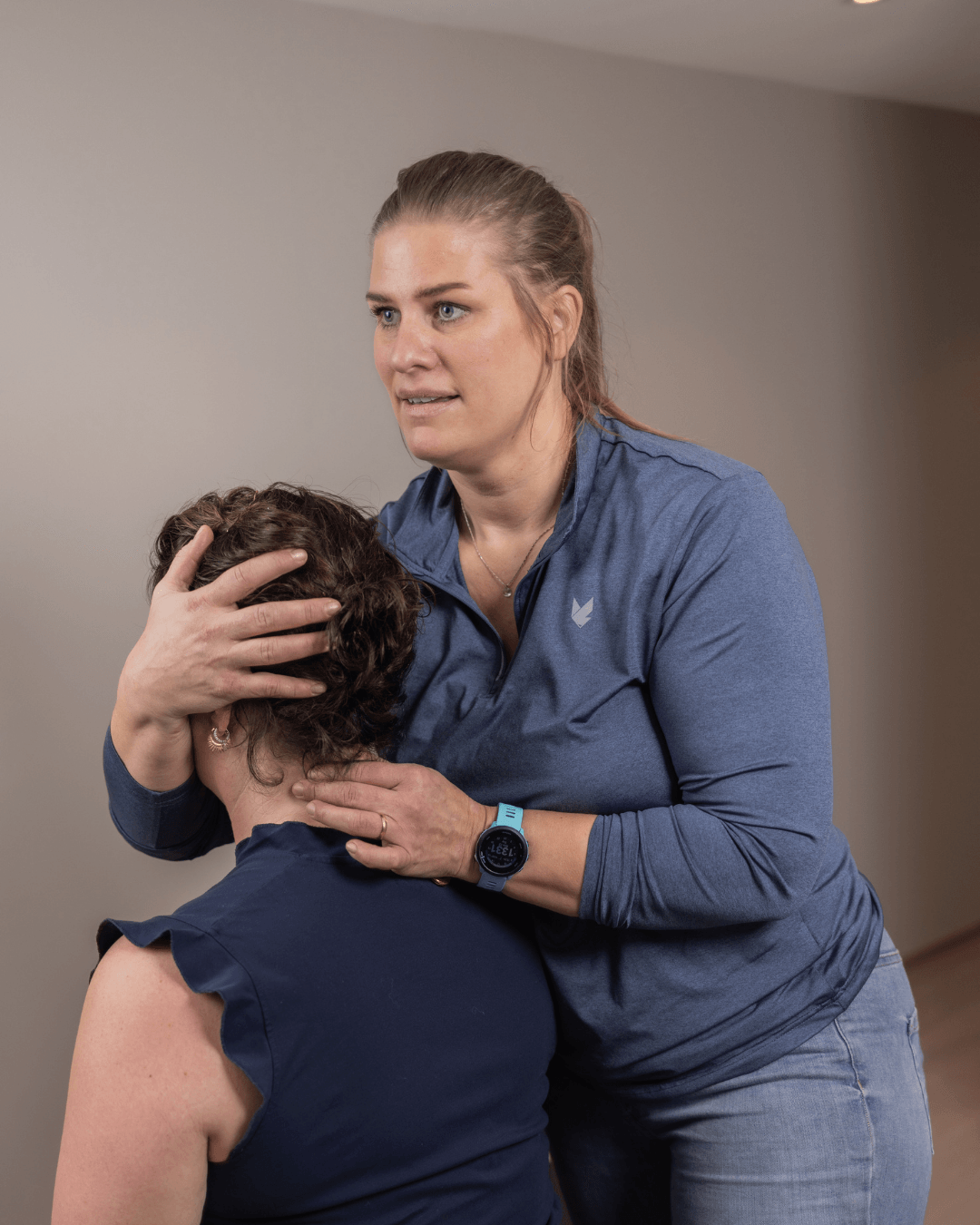 naprapath treating woman neck pain clinic
