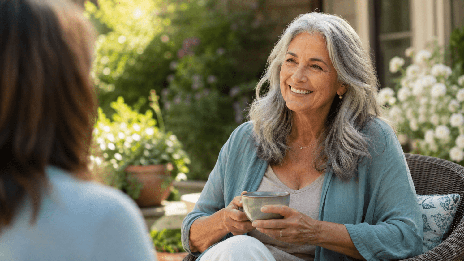 A relaxed woman in her sixties enjoying a calm moment outdoors