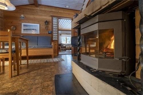 Natural-stone fireplace with burning fire
