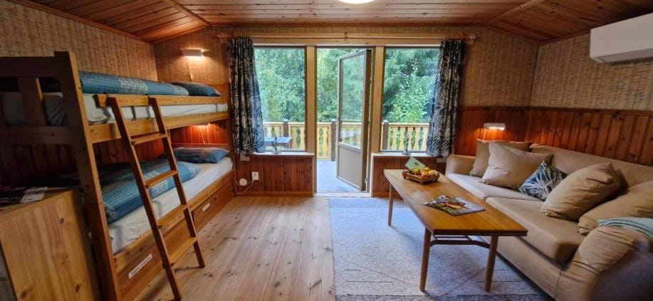 Living room in Fiskarstugan with open door to the terrace