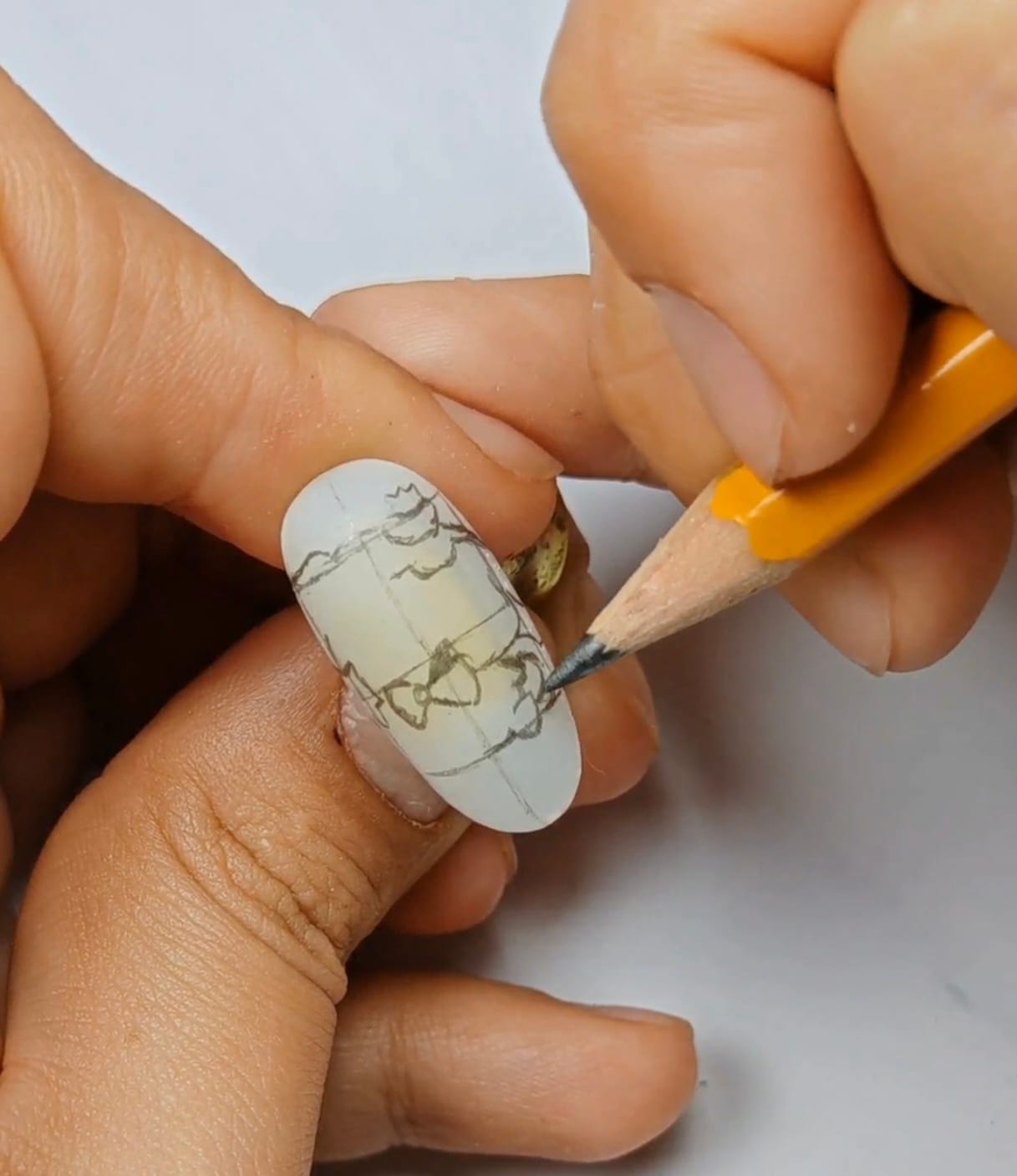 nail artist painting cartoon tip