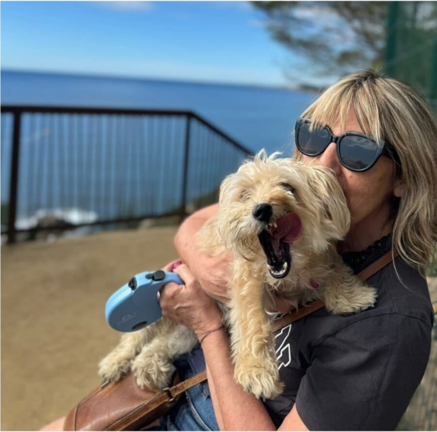 Diane with her dog Roddy by the sea