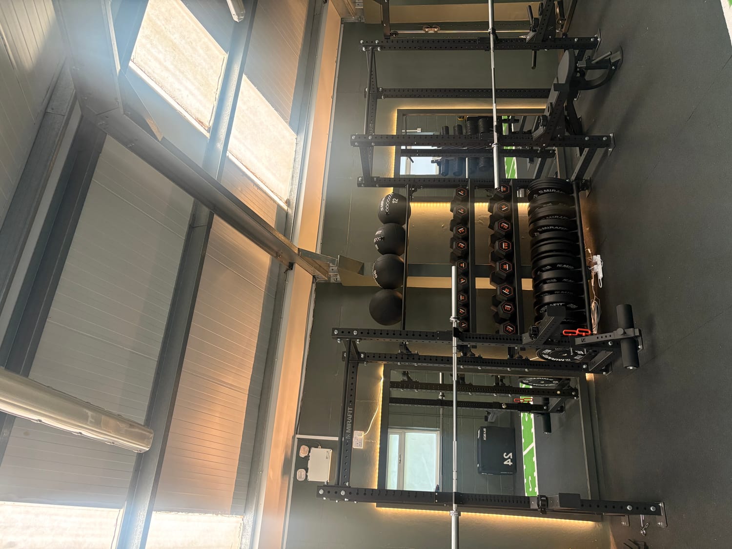 The main training floor - racks, dumbbells and weights