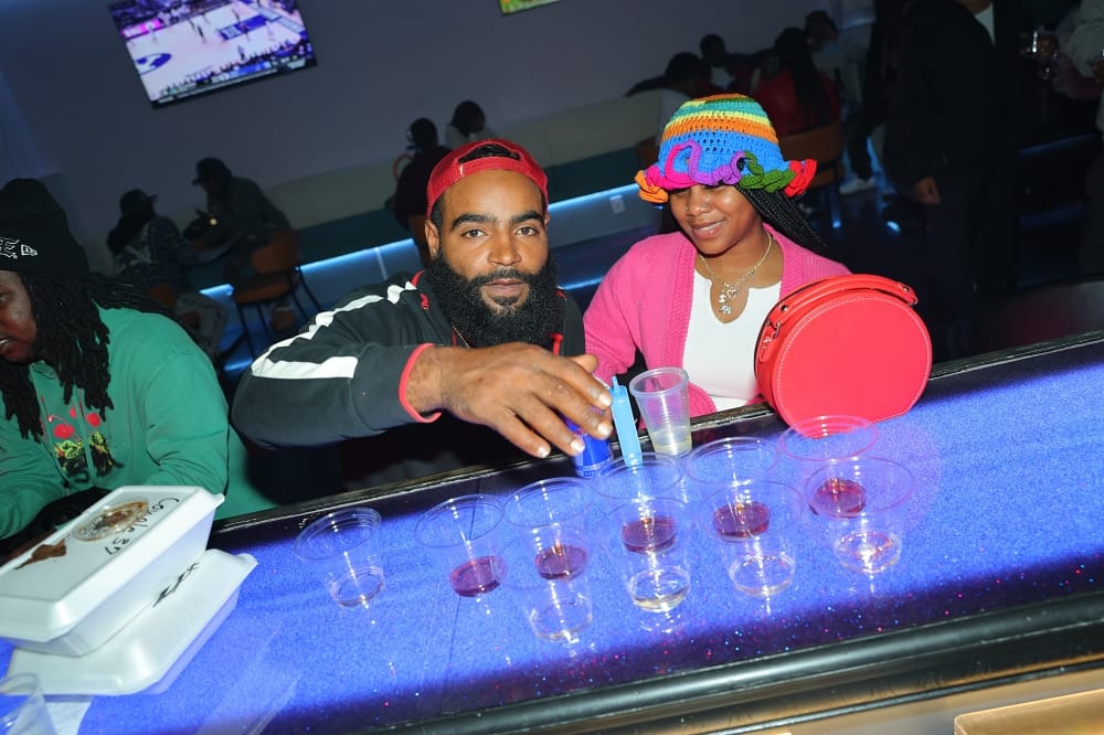 Guests at the bar with drinks at Serenity 5 Restaurant & Lounge, Portsmouth, VA