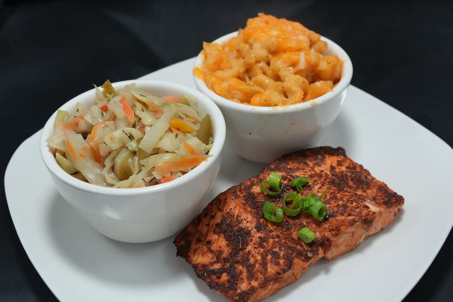 Blackened salmon with cabbage and mac and cheese at Serenity 5 Restaurant & Lounge in Portsmouth, VA