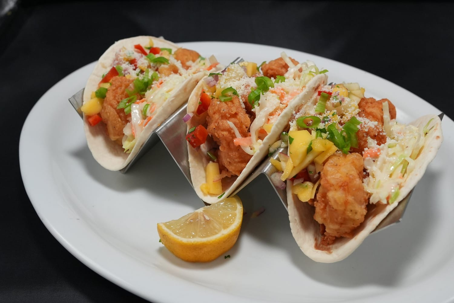 Crispy tacos with mango salsa and slaw at Serenity 5 Restaurant & Lounge in Portsmouth, VA