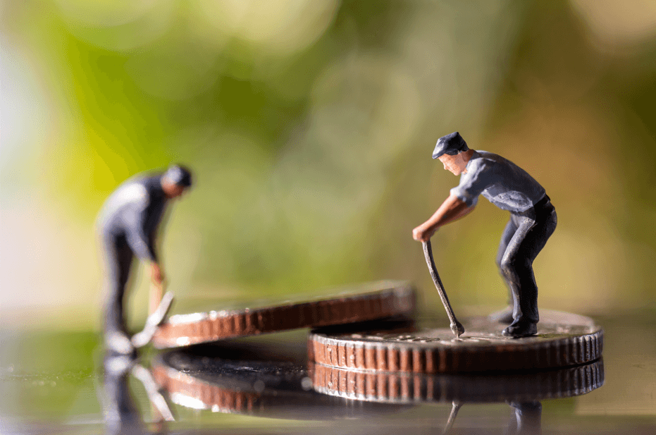 Image of miniature figures working on coins