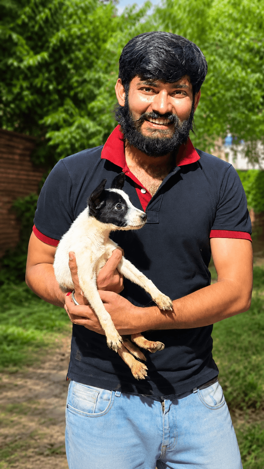 Mayank Tripathi, founder of Umeed Ek Kiran, holding a dog