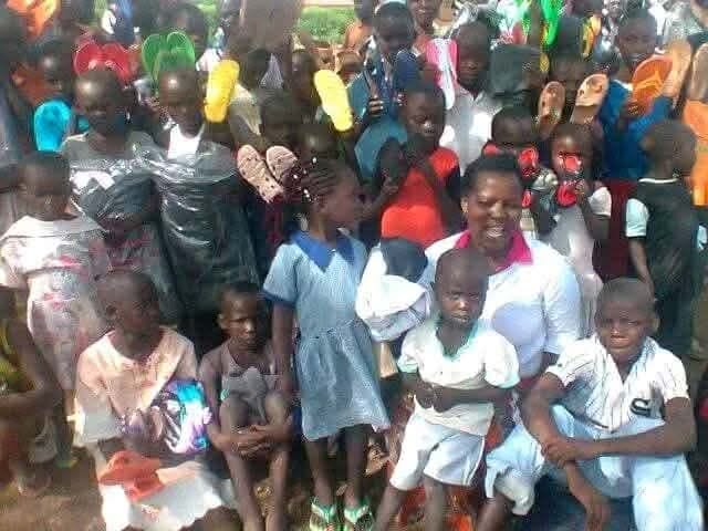 Children receiving shoes at an outreach day