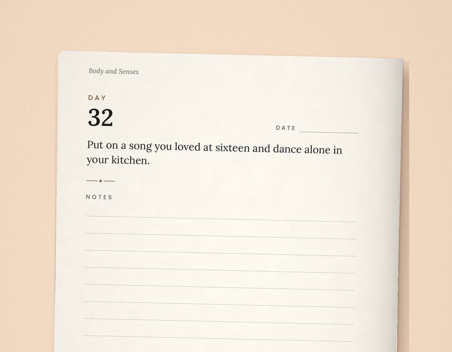 Day 32 page from The Solo Year paperback: Put on a song you loved at sixteen and dance alone in your kitchen.