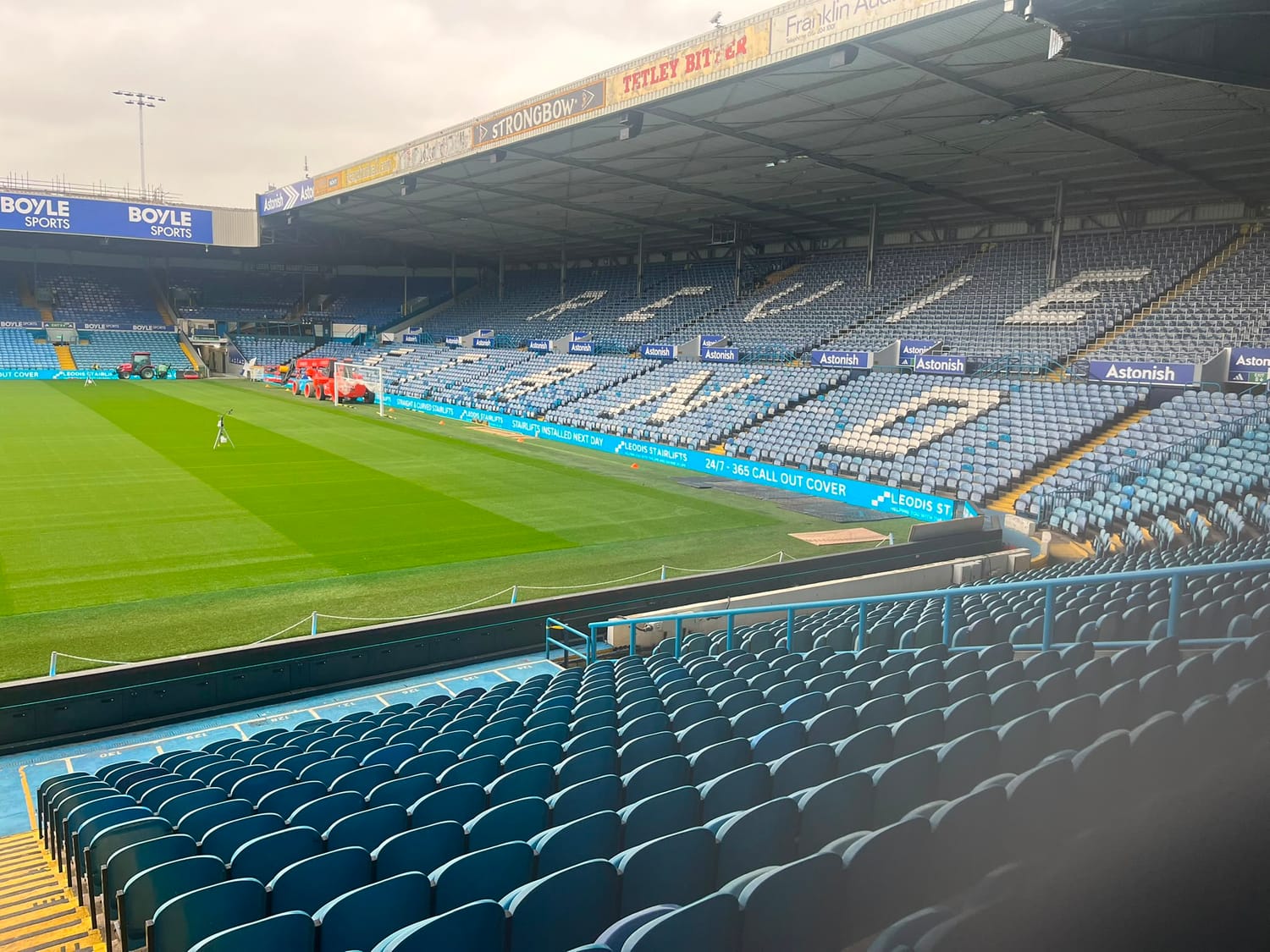 The pitch and rows of seats spelling LEEDS UNITED at Elland Road.