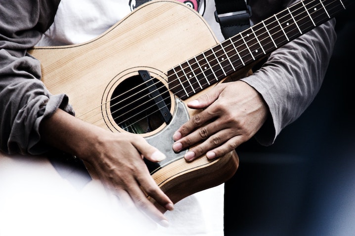 Student learning music theory with instrument