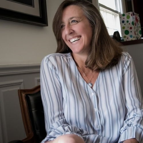 women wearing striped shirt smiling
