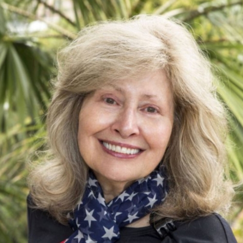 women wearing American flag scarf smiling