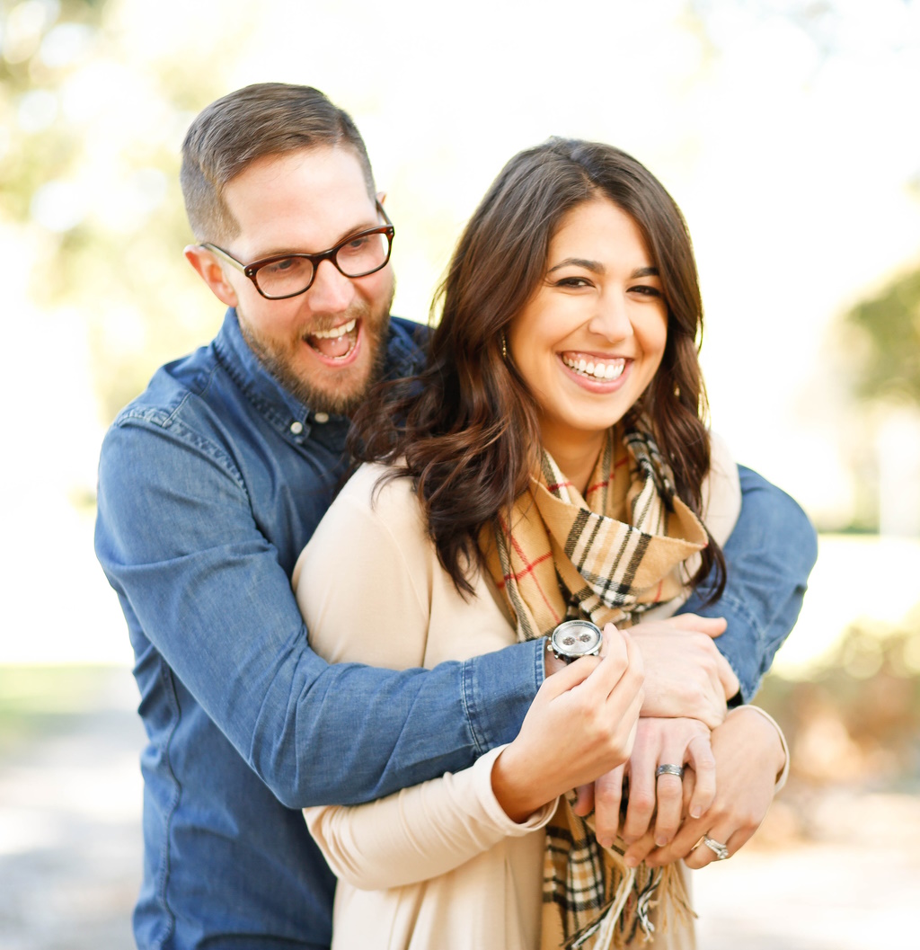 Man Hugging Woman From Behind