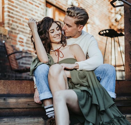 Couple Sitting On Staircase